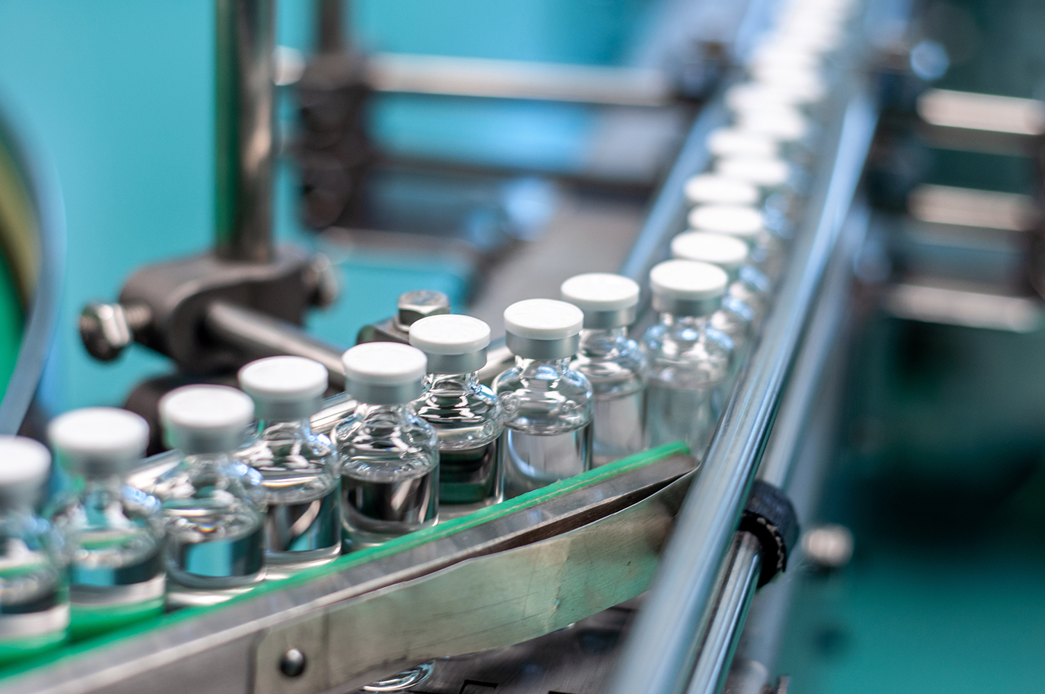 A manufacturing conveyer belt of compounded GLP-1 bottles.