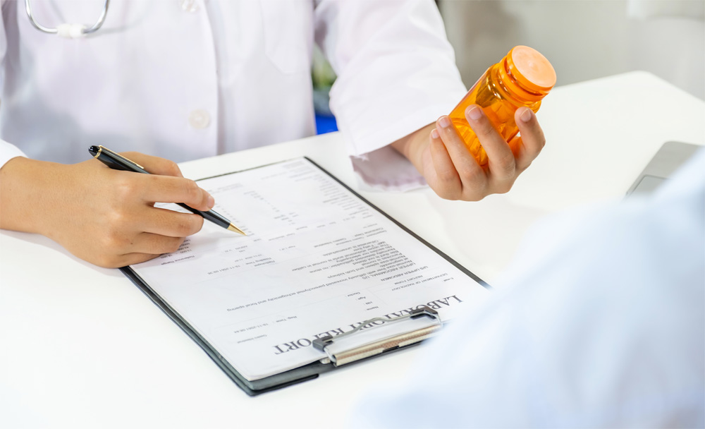 A doctor reviews a patient's lab work results.