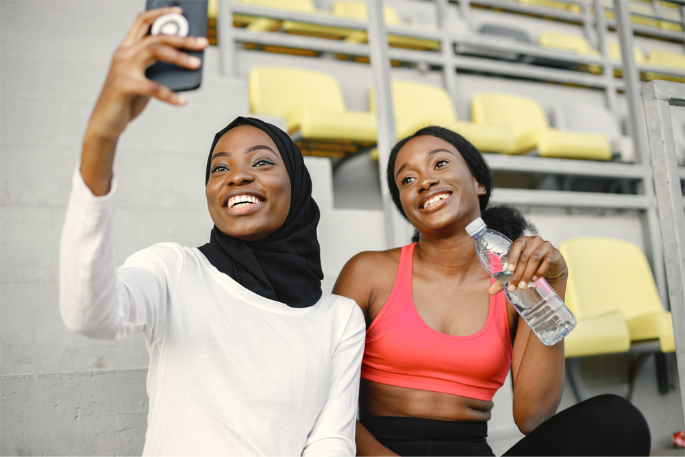 Two women take a selfie after a tournament game.