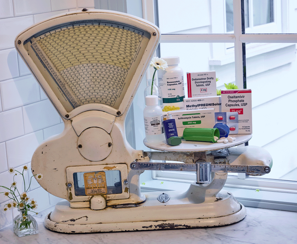 A variety of cold and flu medications on vintage machinery.