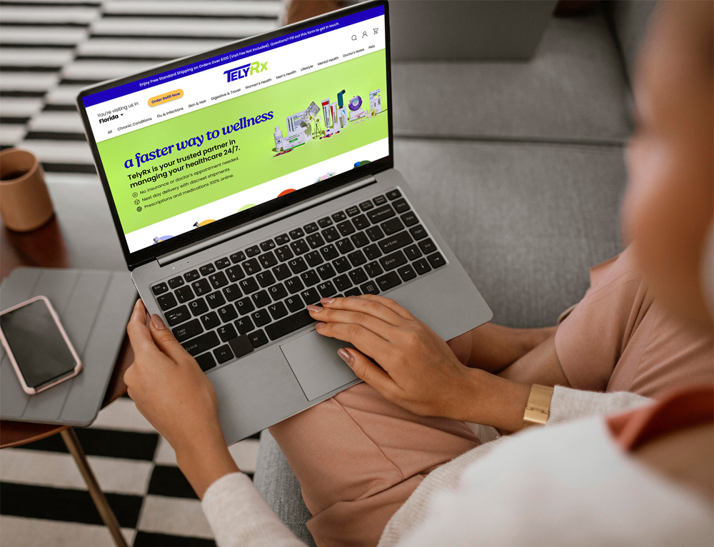 A patient sits on her couch browsing the TelyRx website.