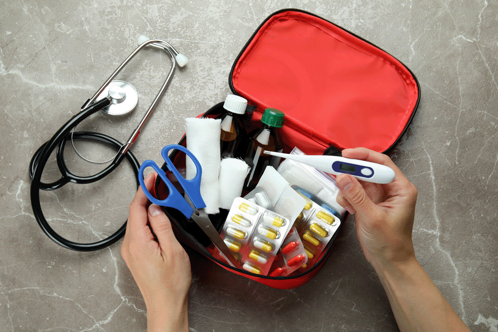 A future traveler organizing their first aid kit.