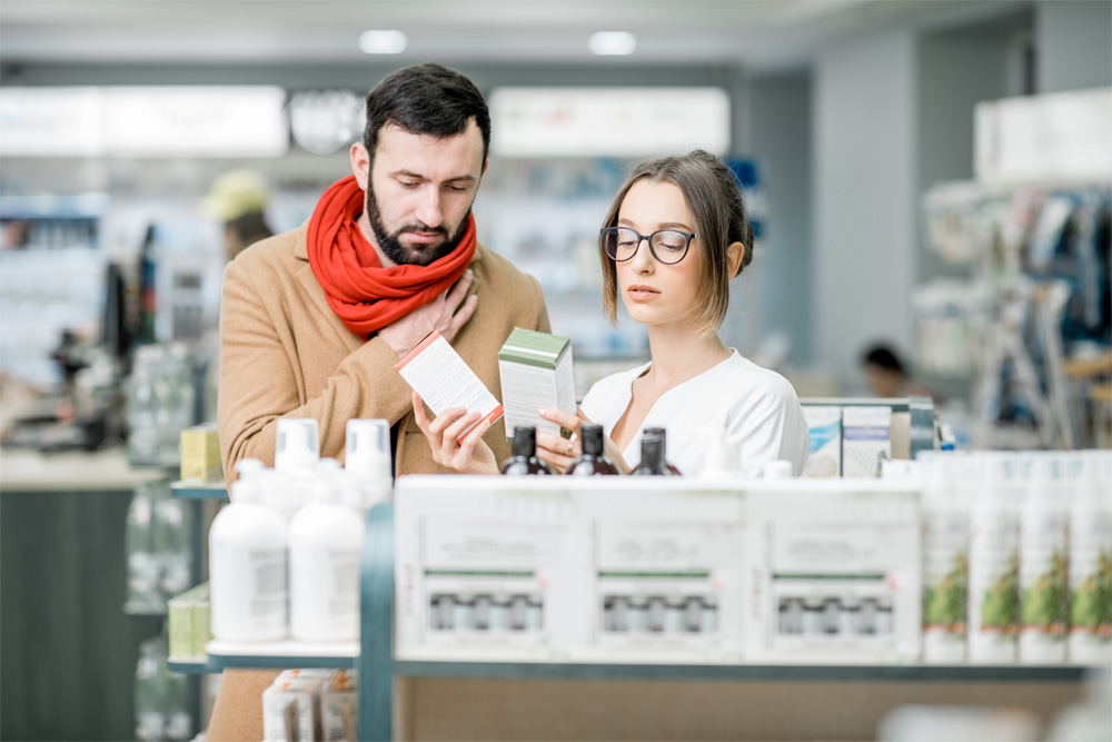 A couple compares two skincare options inside a local store.