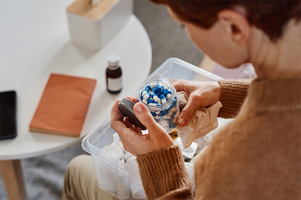 A patient begins opening and organizing their medications for natural disaster season.