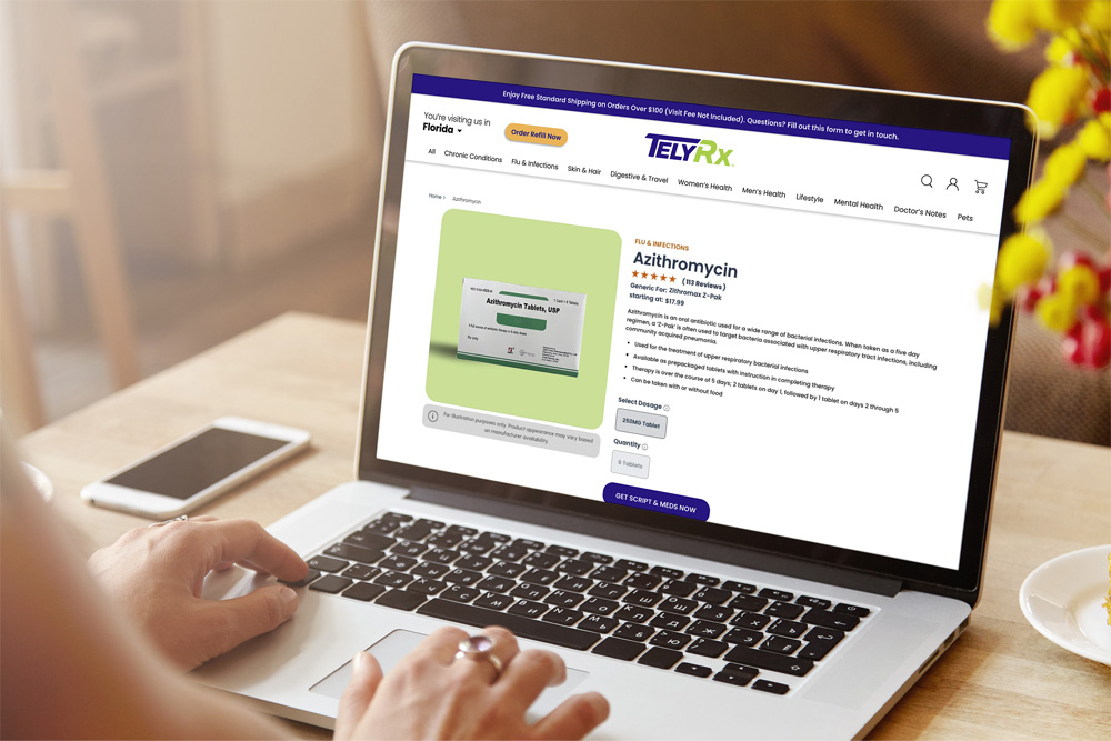 A laptop is opened on the TelyRx website, browsing Z-Paks.