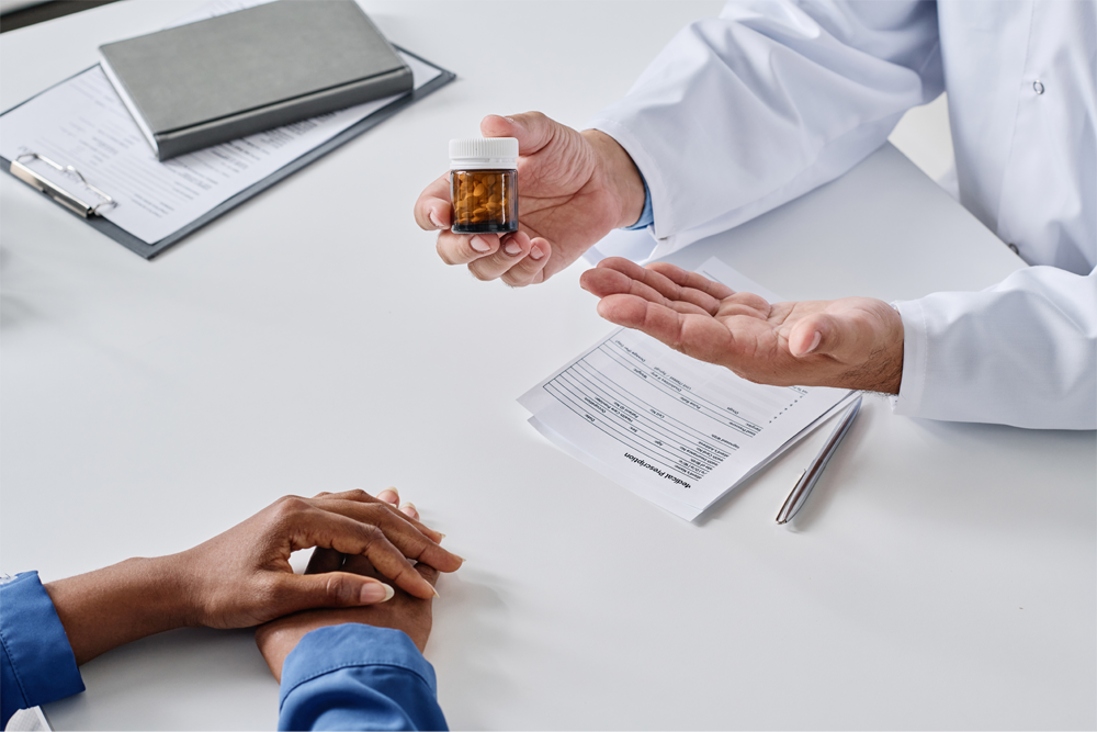 A bottle of antibiotics is shown to a patient.