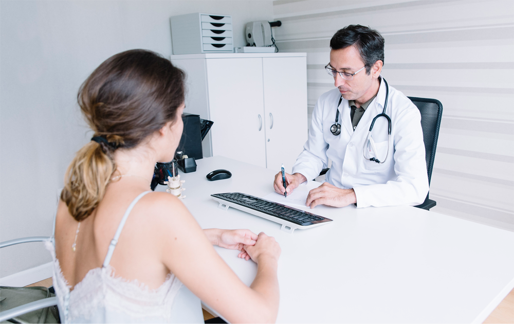A patient being consulted by her provider.