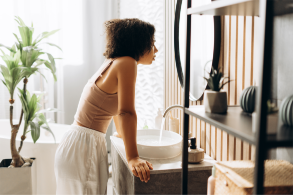 A woman is visibly stressed from her STI symptoms returning.