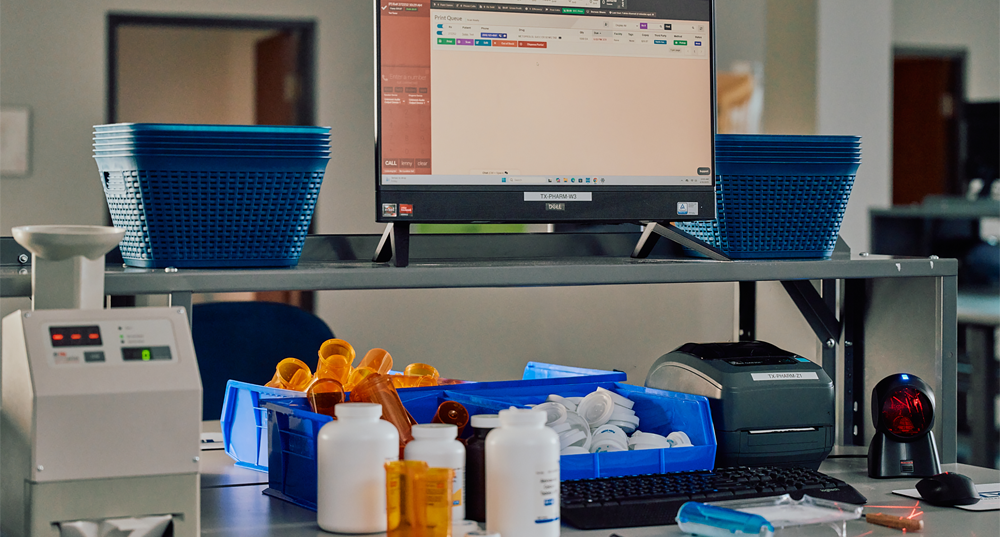 A pharmacist's station to review and fill prescriptions at TelyRx.