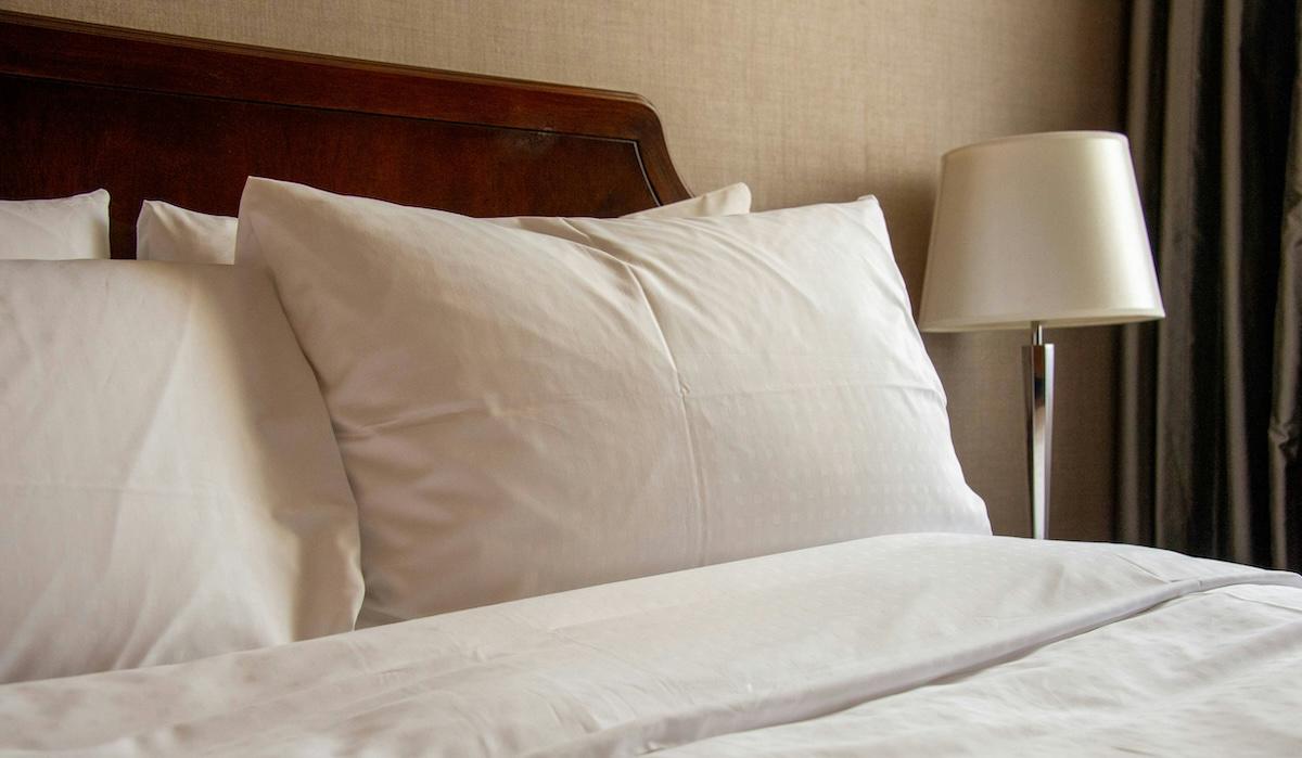 Even seemingly clean hotel and motel linens could hide bed bugs in the seams.